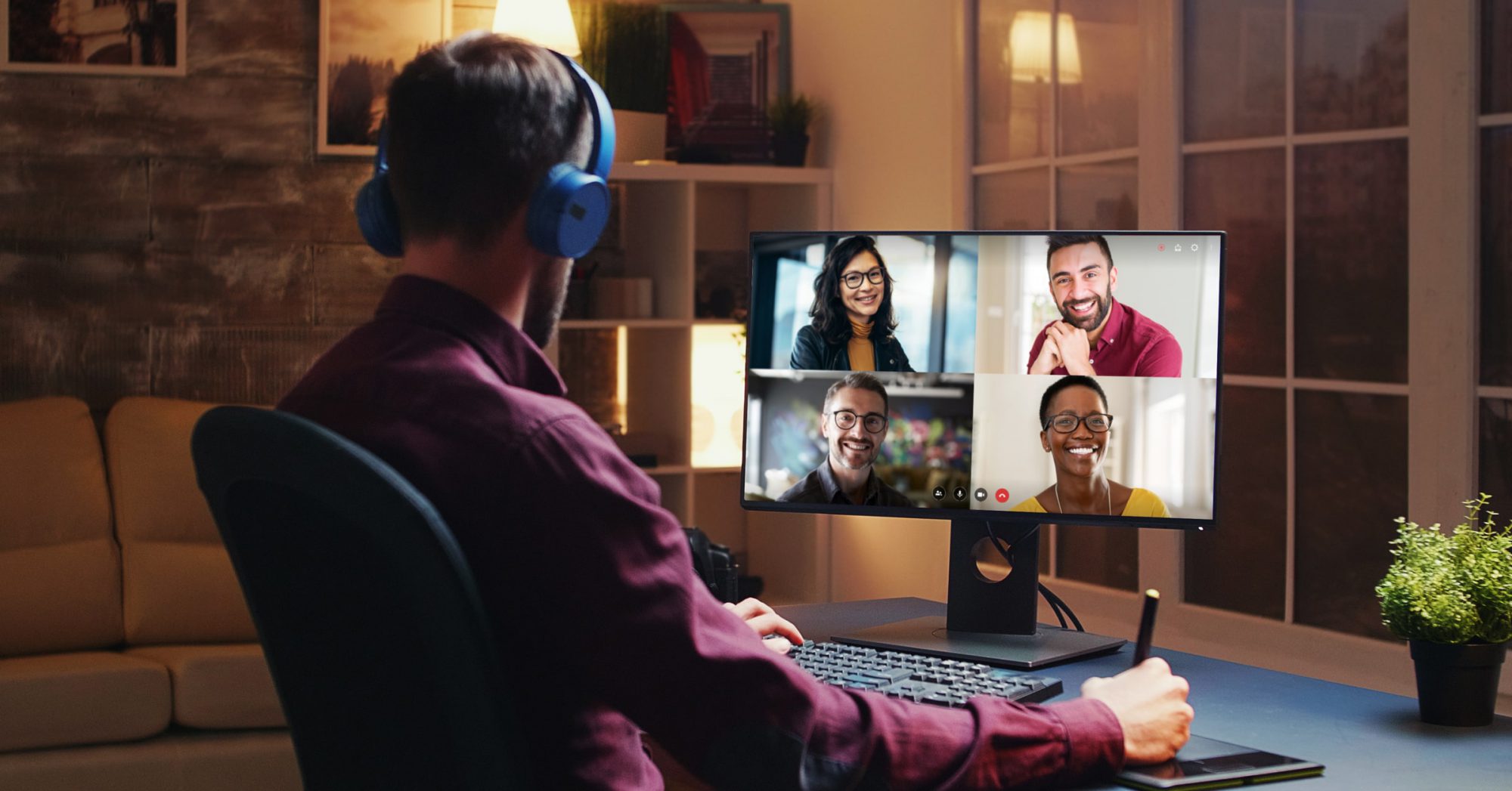 man on a video call sitting behind a desk