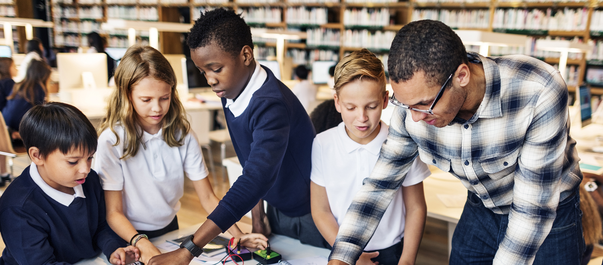 children learning with a teacher