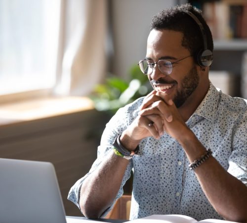 Happy,Millennial,African,American,Man,In,Glasses,Wearing,Headphones,,Enjoying